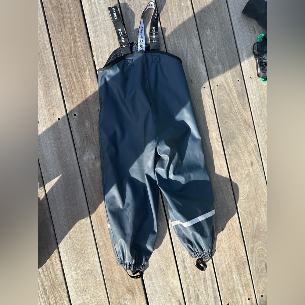 Polarn O. Pyret waterproof rain pants, fleece lined with suspenders